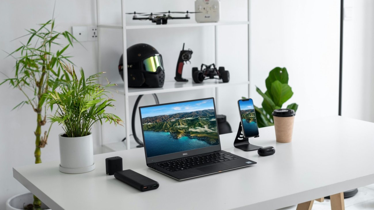 black laptop computer on white table