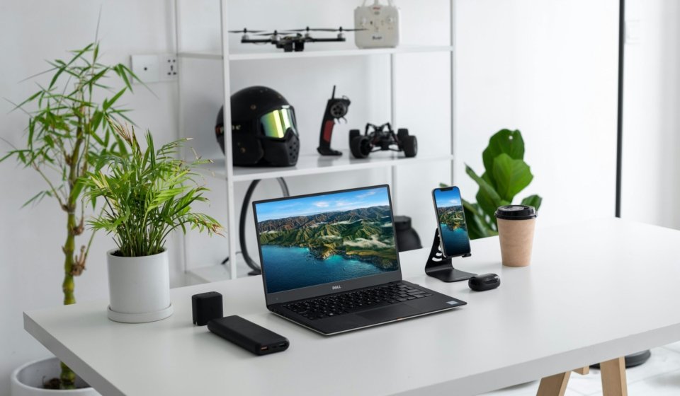 black laptop computer on white table