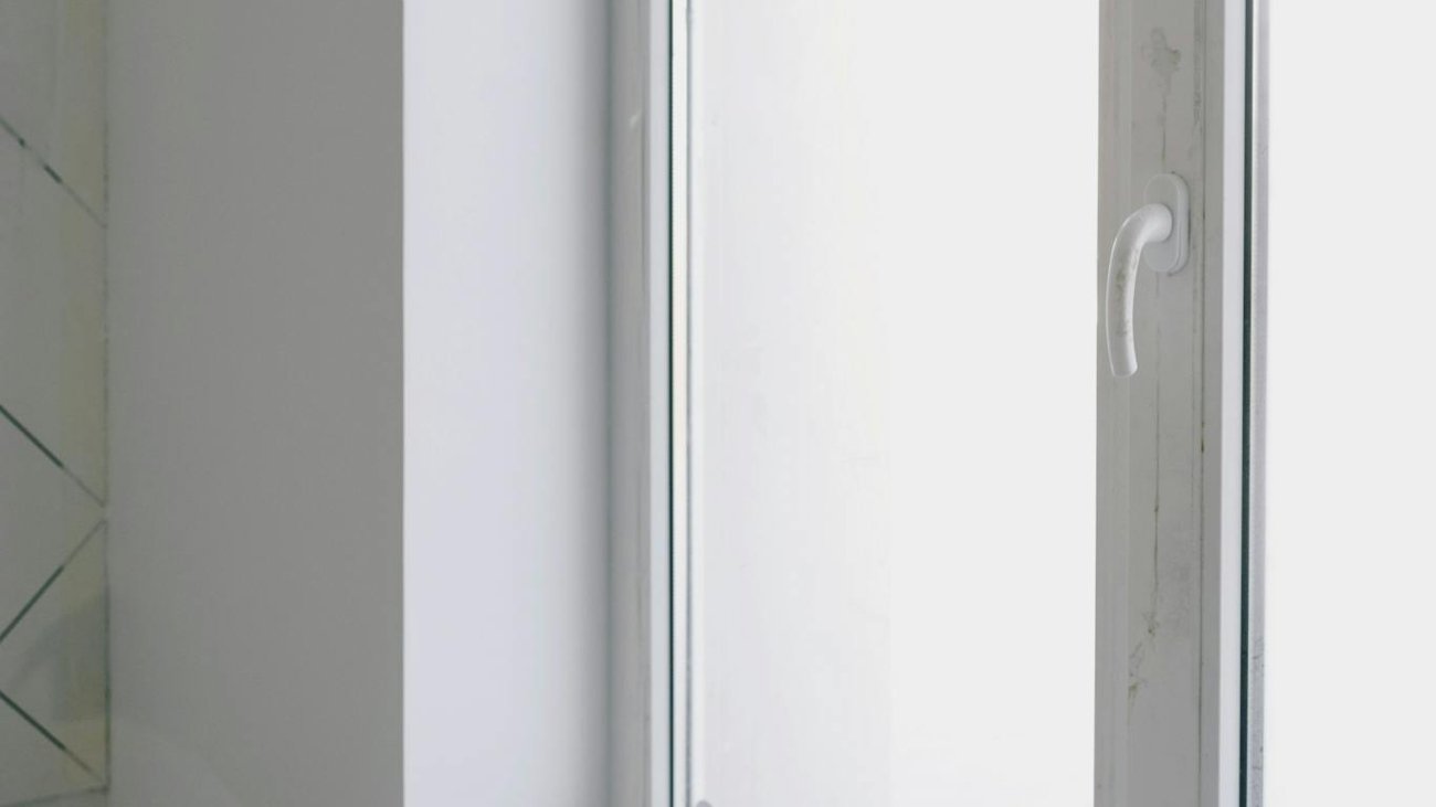 Dirty table near window with tools