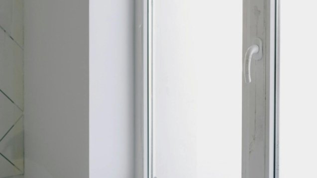 Dirty table near window with tools